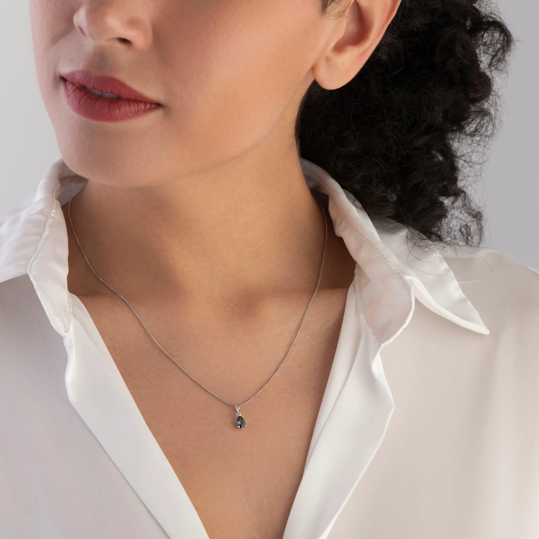 Beaverbrooks 9ct White Gold Blue Topaz Pendant